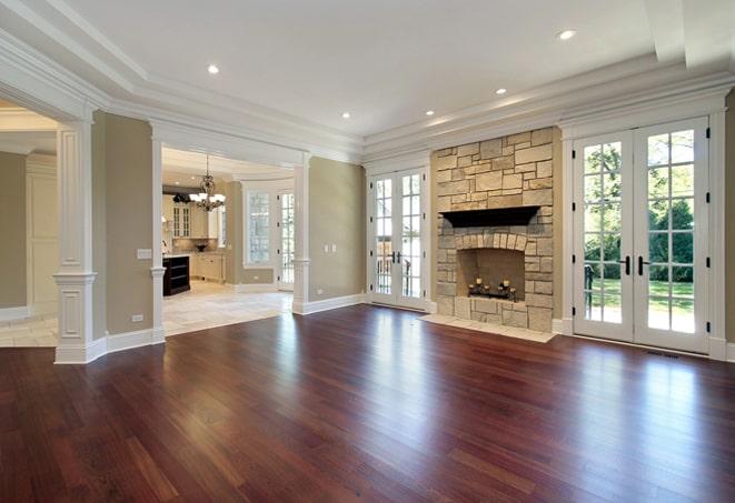 bright, light-colored wood flooring in a spacious bedroom